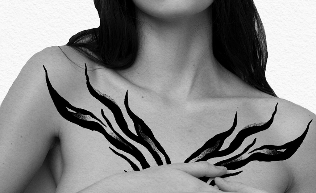 Blackwork flash tattoo on chest